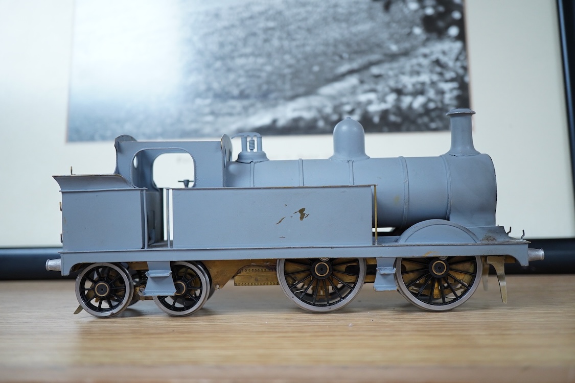 Eleven 0 gauge model railway items including; a bogie stake wagon, two mineral wagons, a North British coal wagon and two further open wagons, a partly constructed brake van, together with a Lima LMS 4F locomotive, two L